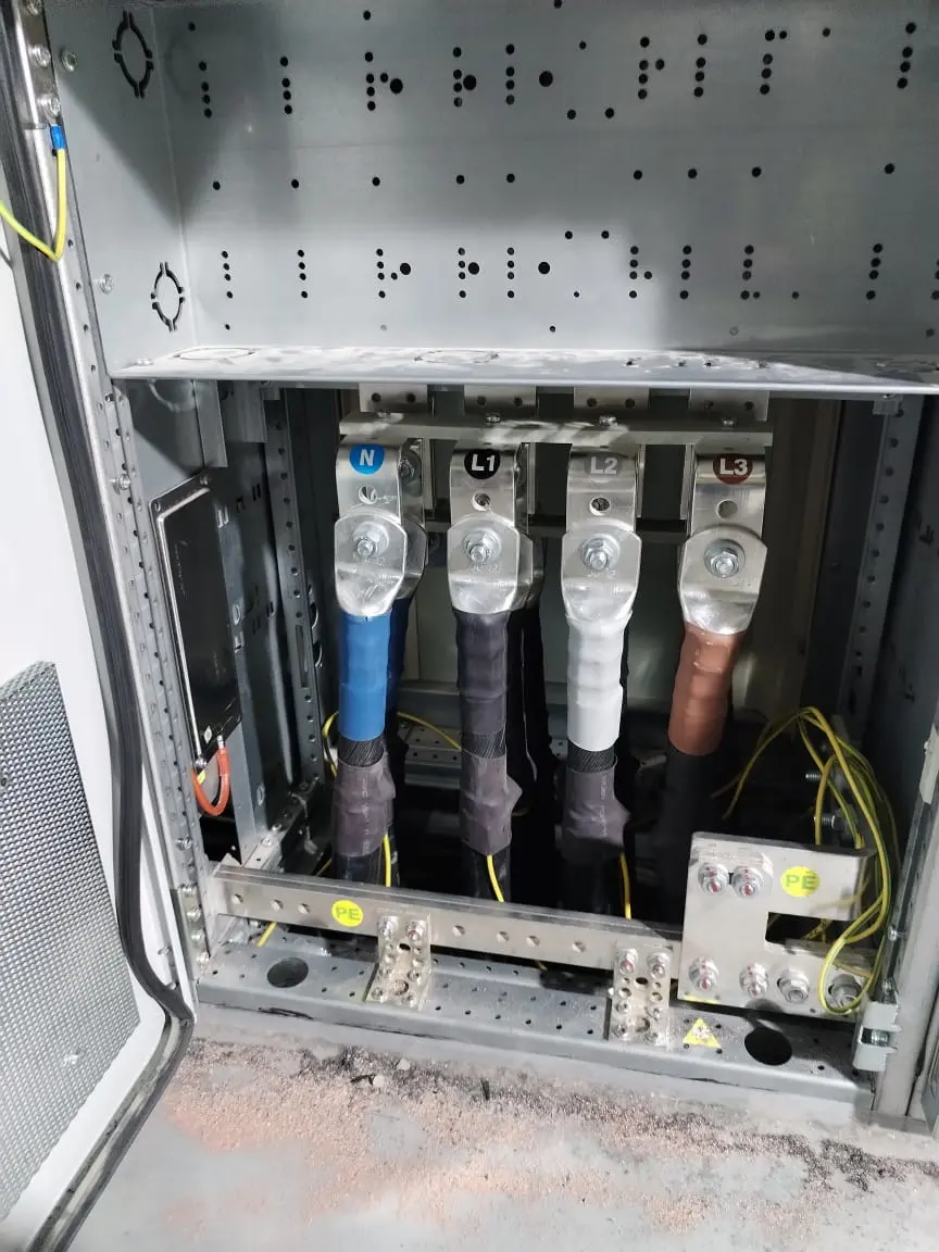 Lugged power cables connected in a switchgear bay