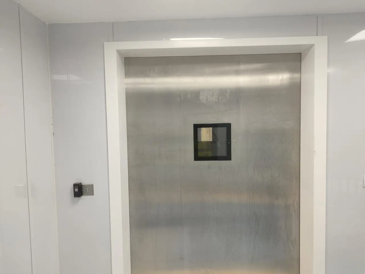 Access-controlled door with card reader in the burn unit