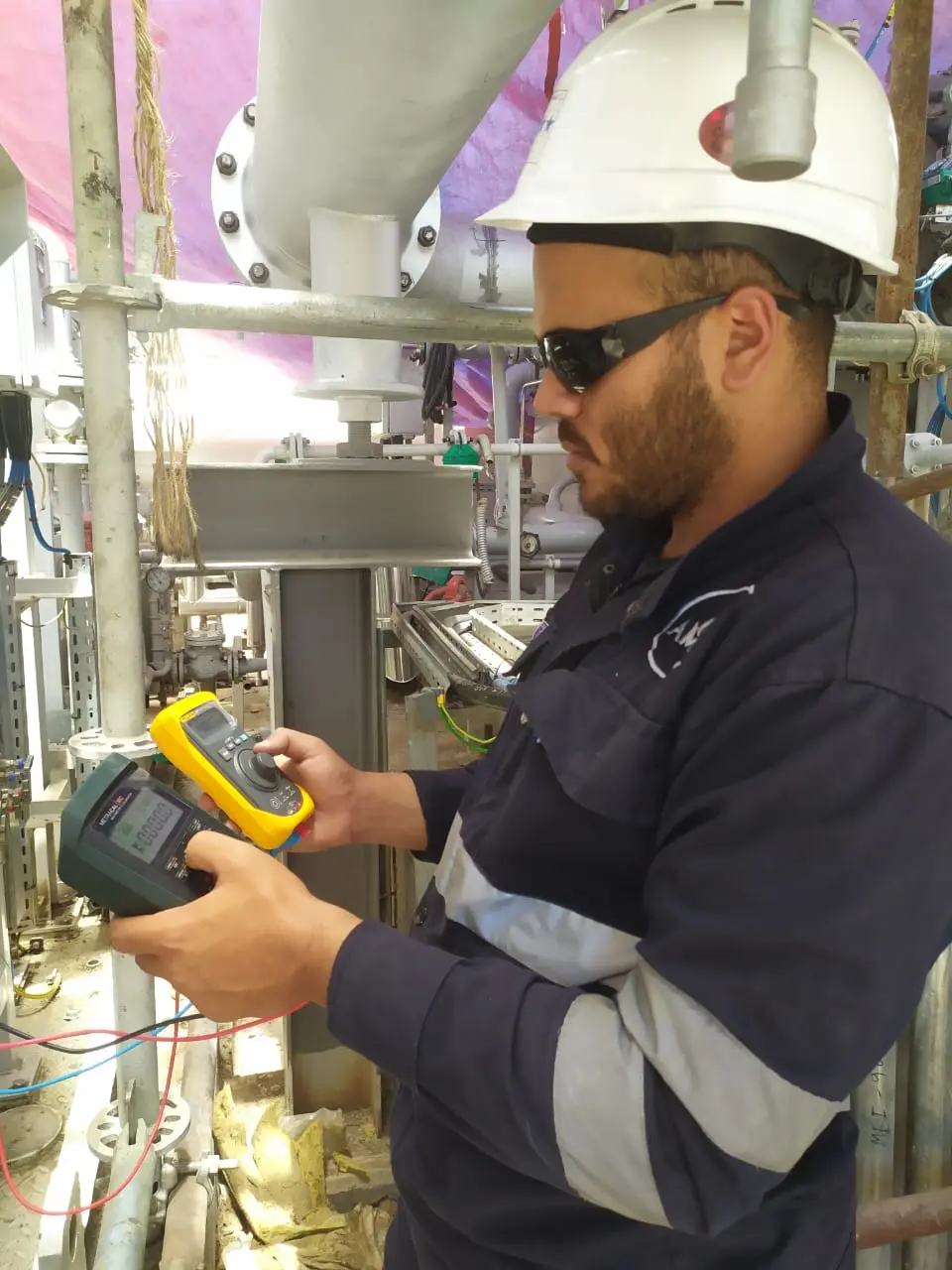 Technician testing instrumentation during commissioning